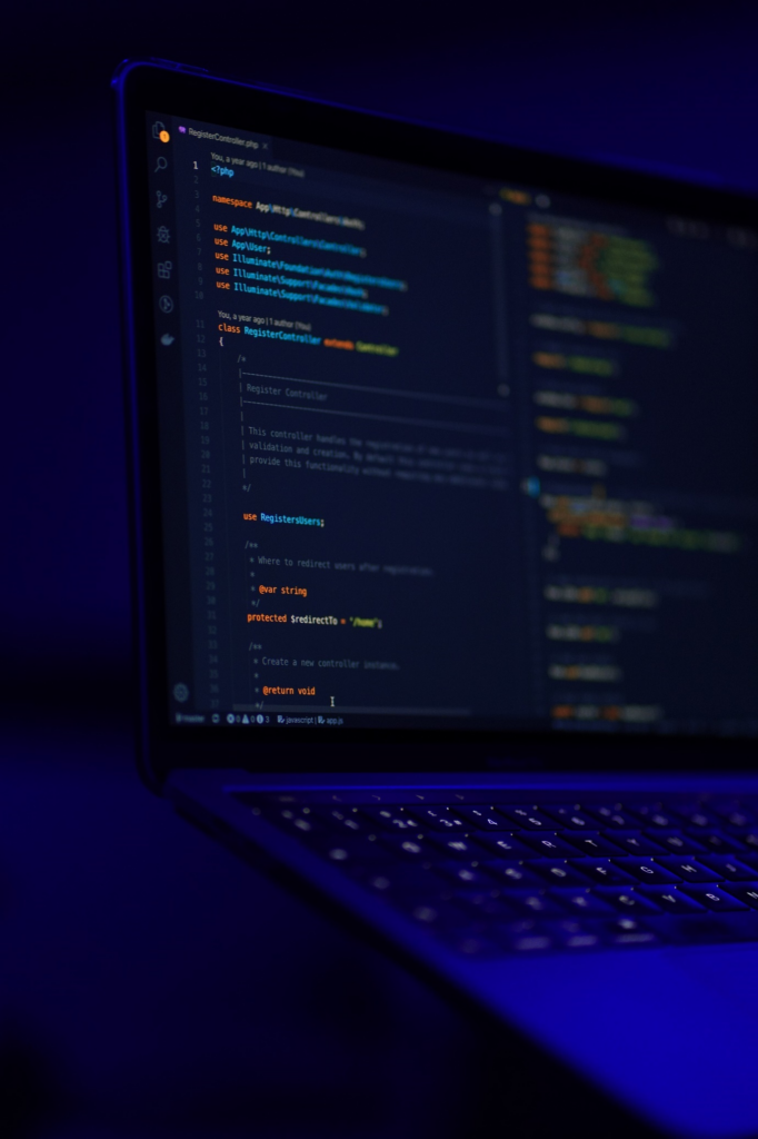 Better-Software-with-AI Laptop showing code on a dark desk