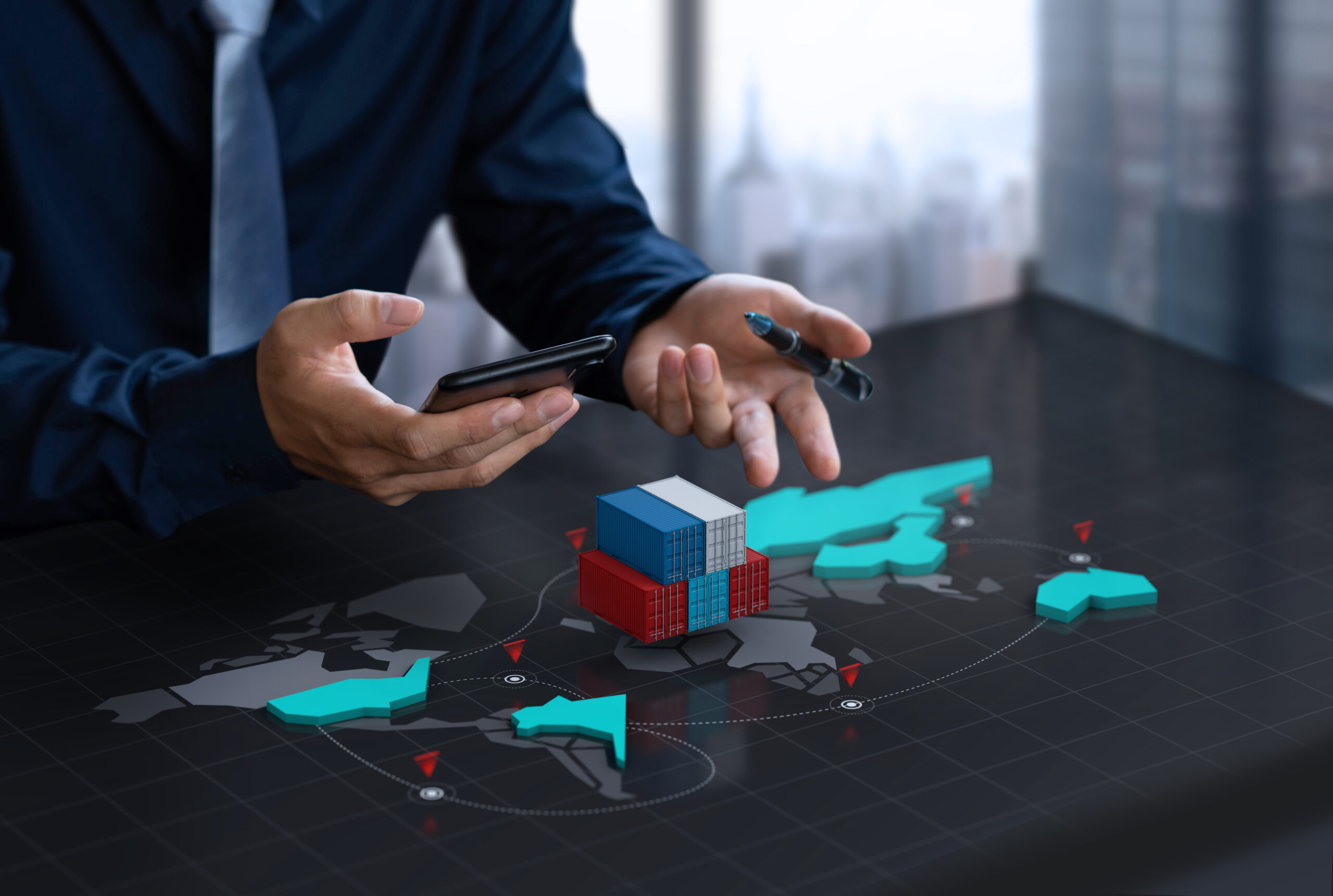 Hands holding a tablet with a 3D container model over a world map