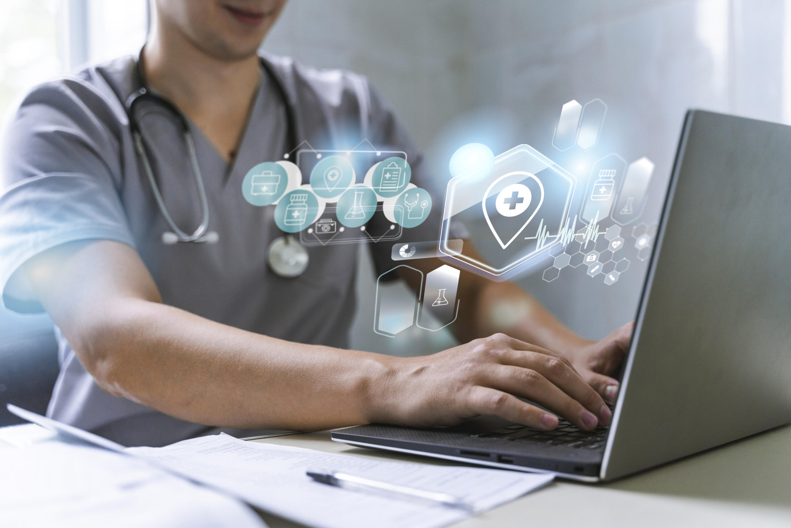 Doctor using a laptop with digital health icons
